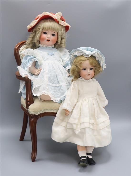 A Heubach Koppelsdorf 320 doll, an Armand Marseille 390 doll and a dolls chair